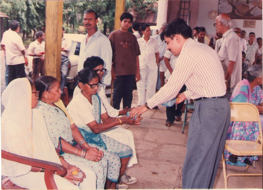 Shri Ajit Kucheria at the Leprosy Home at Wadala distributing Medicines etc